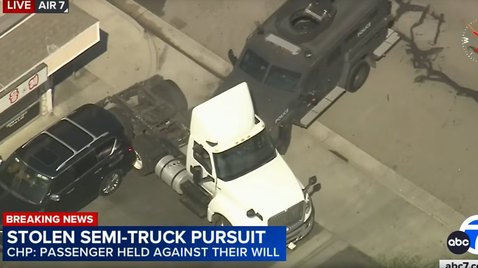 Watch a SWAT Truck Try to End a Semi Truck Police Chase by Ramming it