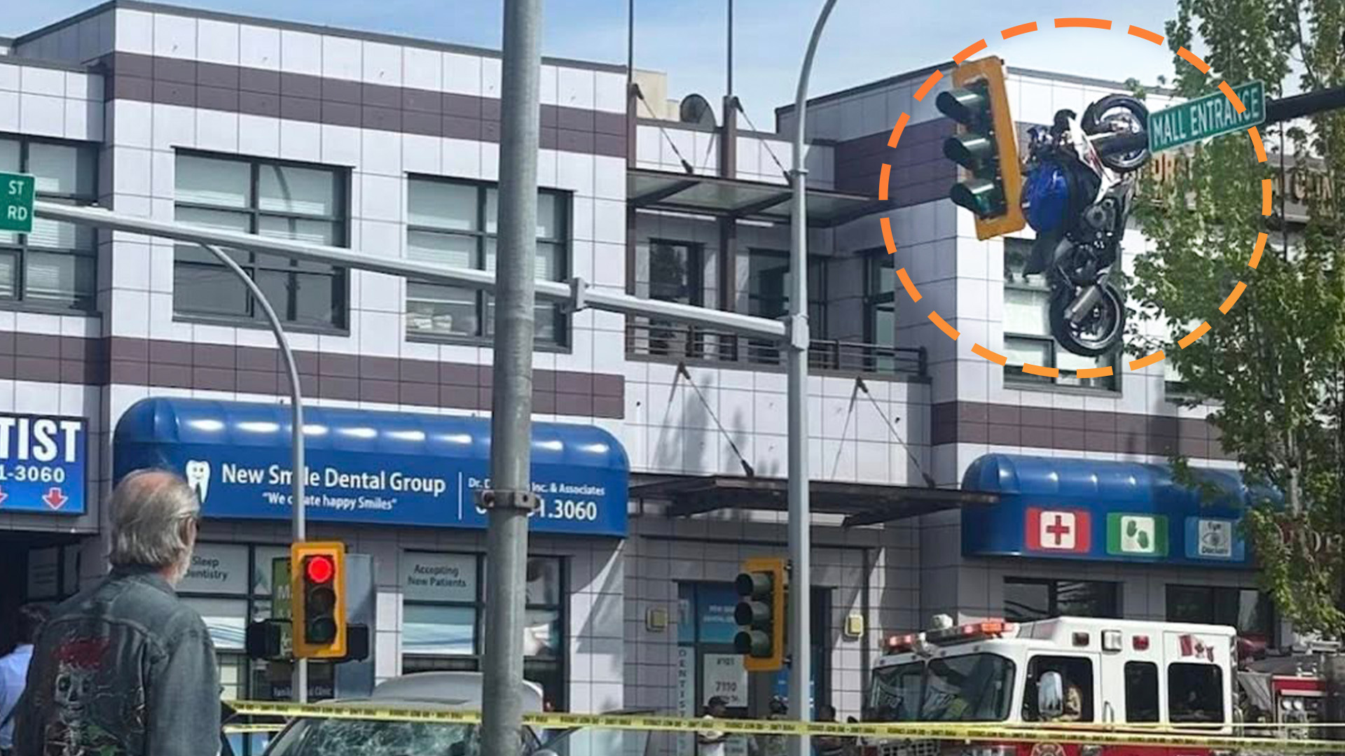 Crash Leaves Sportbike Hanging From Traffic Light in Accidental Trick-Shot Parking Job